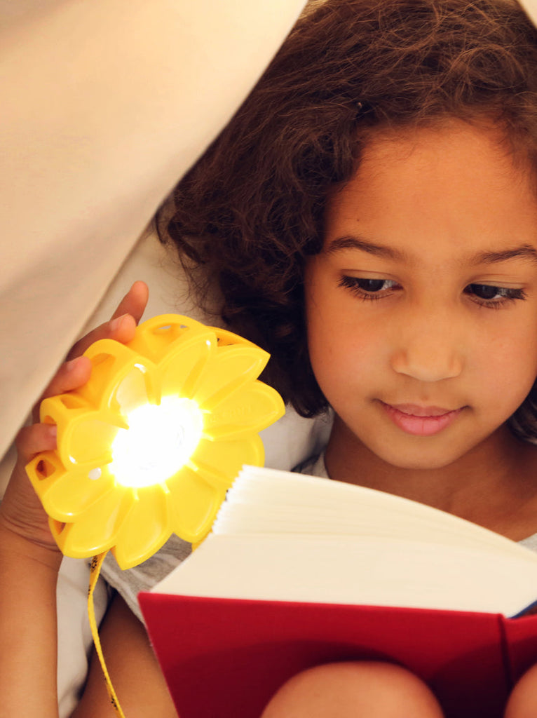 Little-girl-reading-with-Little-Sun-Original_credit-Franziska-Russo_4b718595-42b7-4218-aecb-d541784d1d2a.jpg